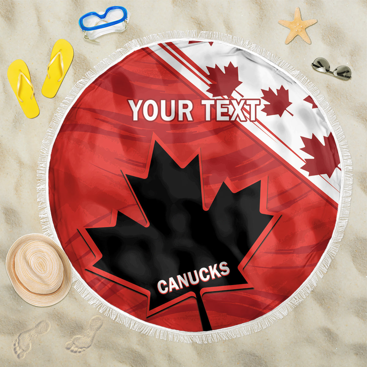 Red round beach blanket with fringe, 'YOUR TEXT' and Canucks maple leaf on sand