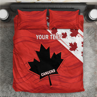 Red bedding set with maple leaf and star graphic; two red pillow shams.