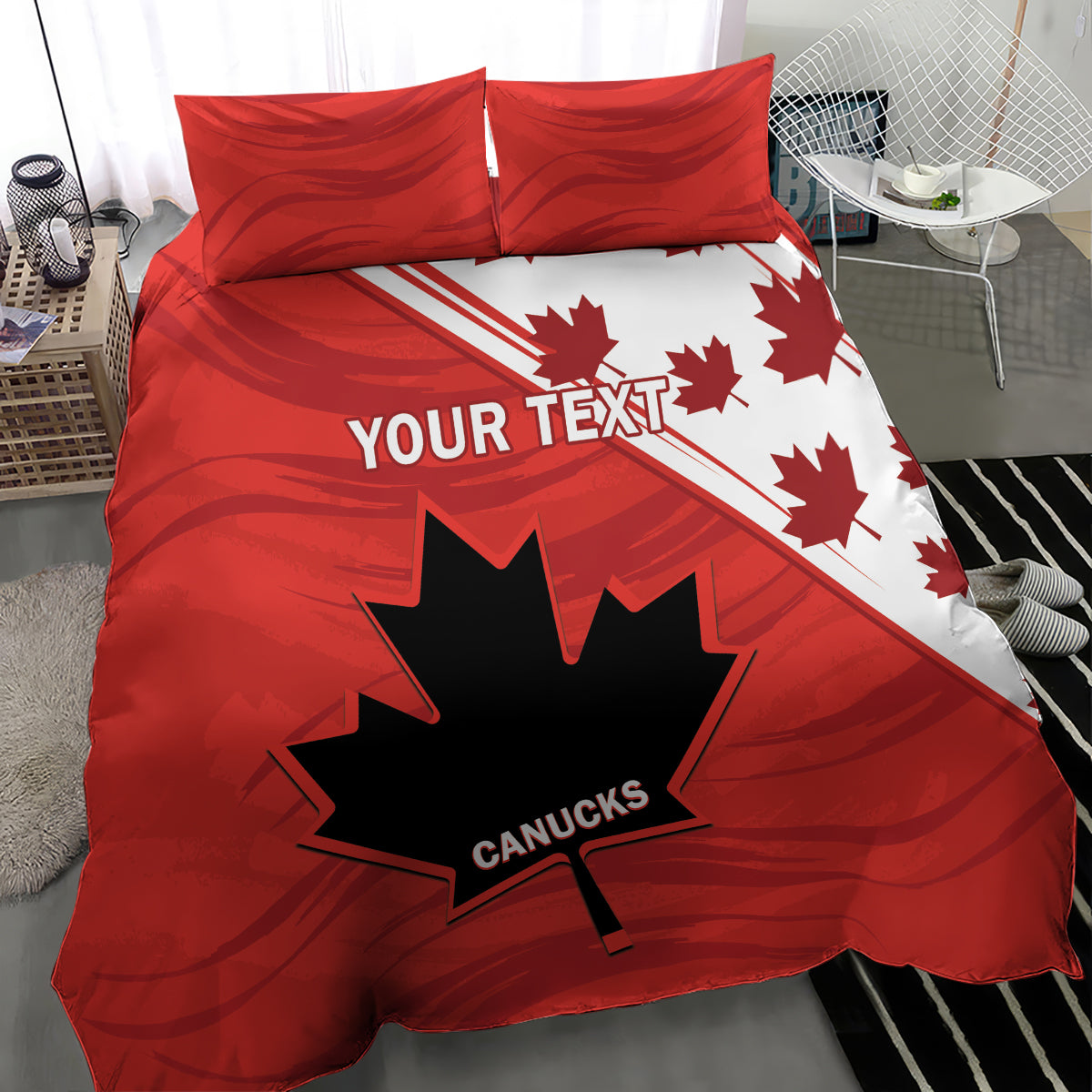 Red and white duvet cover with maple leaf and star graphic; two red pillow shams.