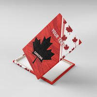 Red canvas wall art with black maple leaf and YOUR TEXT, CANUCKS, angled view
