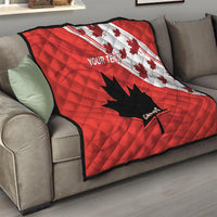 Red quilt blanket with white Canada maple graphics, black leaf-star, and 'YOUR TEXT'