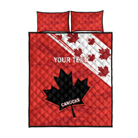 Red quilt bed set with two pillow shams, black quilt panel, white maple leaf shapes and CANUCKS