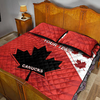 Red quilt bed set with quilted pattern, CANUCKS logo, maple leaf graphics, two pillow shams