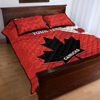 Red quilt bed set with CANUCKS logo on black-and-white maple leaf design, two pillow shams
