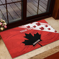 Red doormat near doorway with black maple leaf and 'YOUR TEXT' banner plus 'CANUCKS'