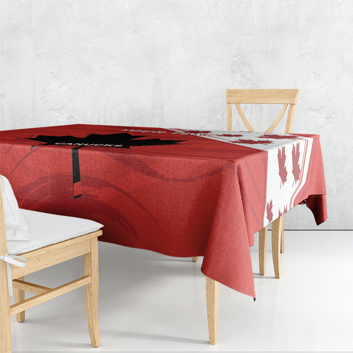 Red tablecloth corner with black stripe detail and white maple leaf accents