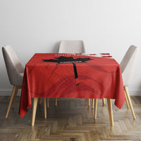 Red tablecloth on table with centered black stripe and YOUR TEXT