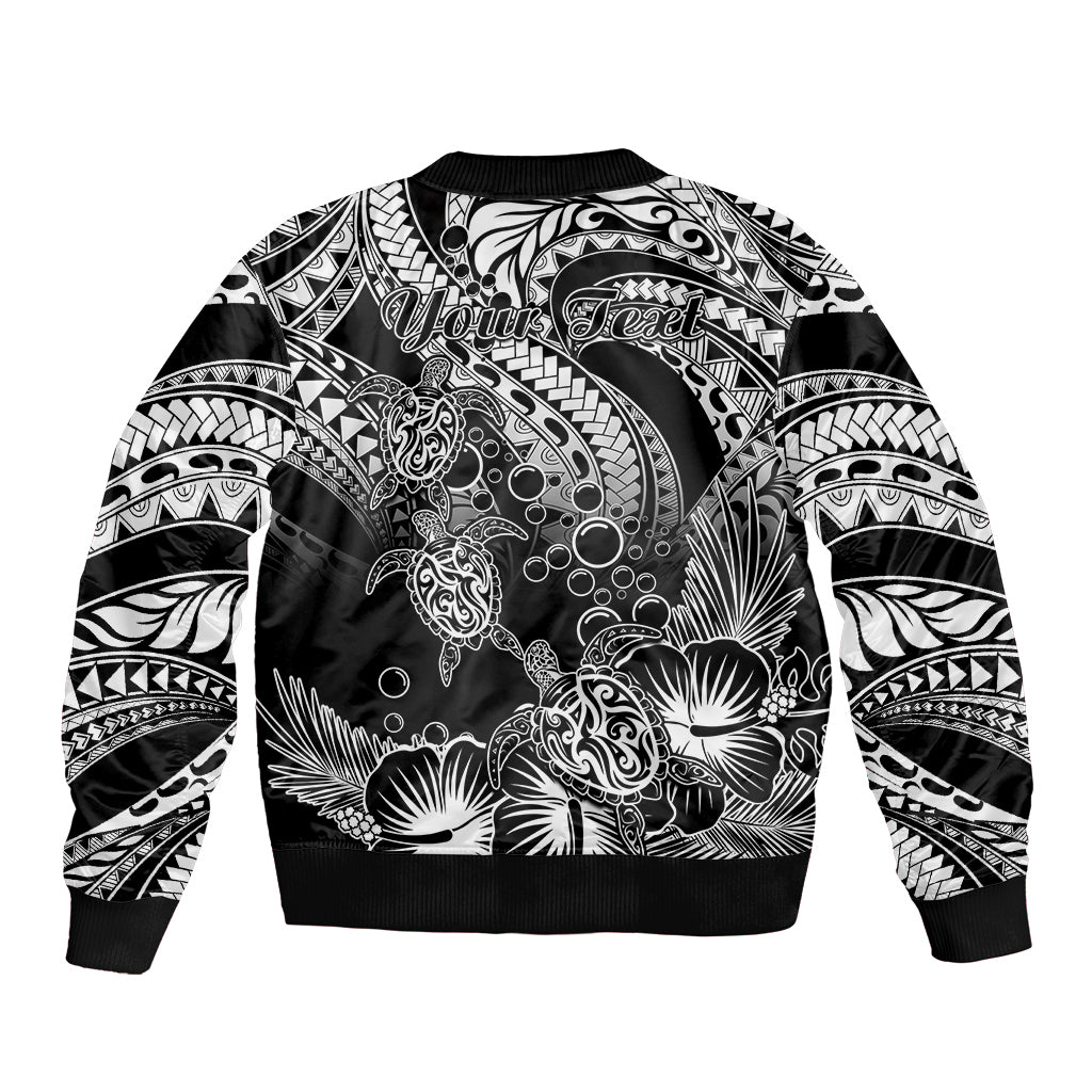 Black bomber jacket back with "Yours Teet" text and tribal turtle floral print, ribbed hem