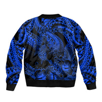 Blue and black bomber jacket with tribal turtle pattern, ribbed collar and cuffs