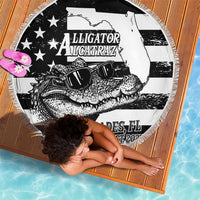 Folded round beach blanket with fringed edge, black-and-white alligator and star pattern
