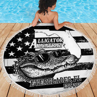 Round fringed beach blanket showing black-and-white alligator with sunglasses graphic