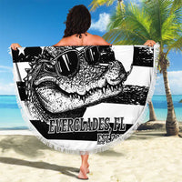 Round beach blanket with fringed border and bold black-and-white alligator flag print