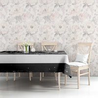 Black and white striped tablecloth on dining table with draped corner and graphic band