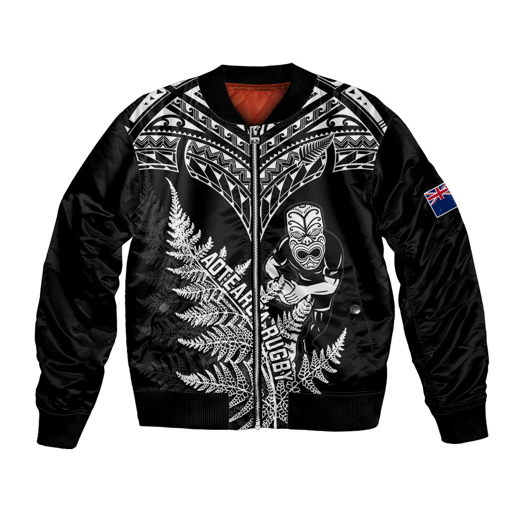 Black bomber jacket with zip, silver fern graphic and flag patch on sleeve