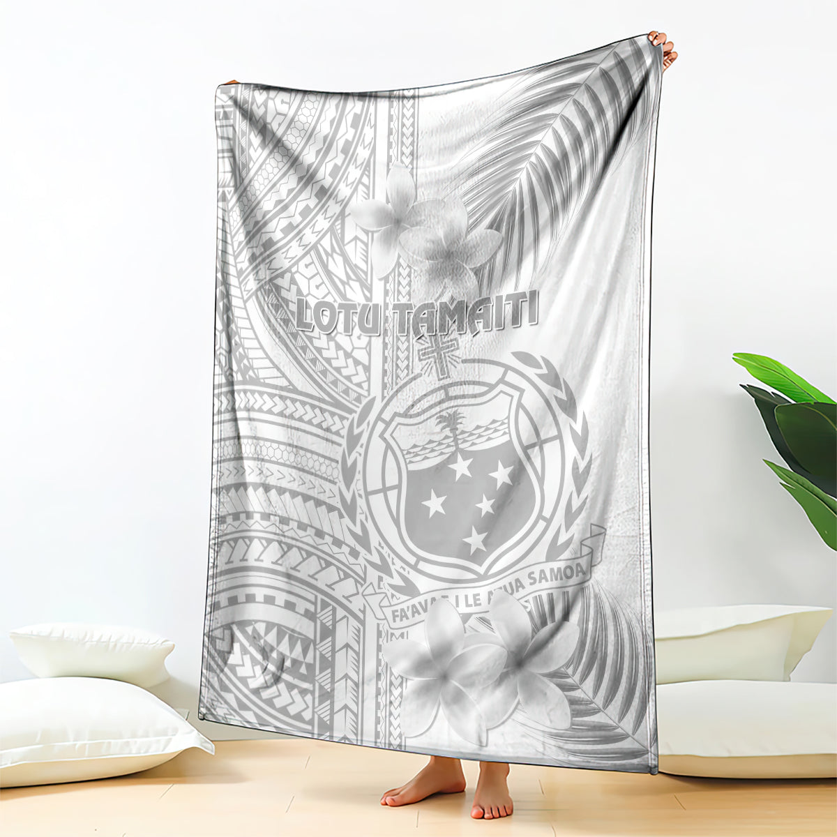 White and gray Polynesian style throw blanket with floral plumeria and crest design