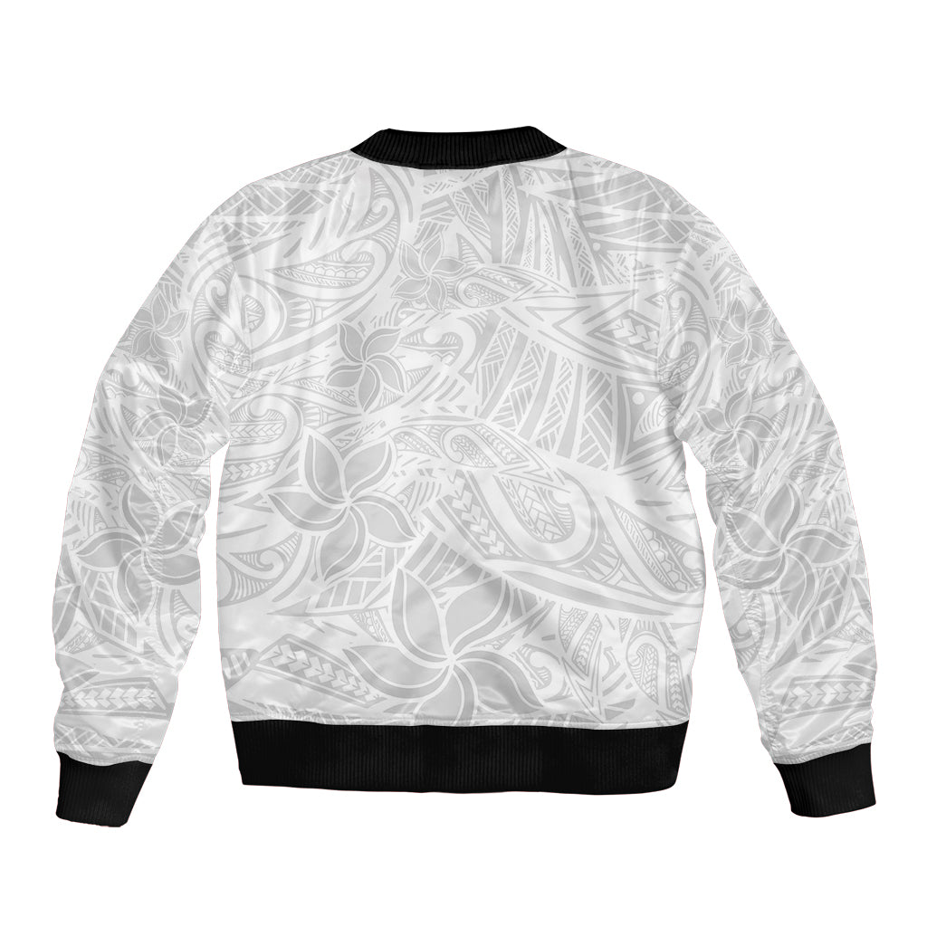 White bomber jacket with tropical leaf/flower print on back, black ribbed collar, cuffs, hem.