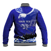 Blue varsity baseball jacket with eagle back graphic, Polynesian pattern, ribbed striped trim