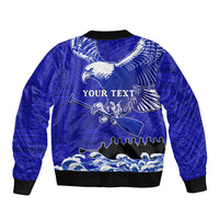 Blue bomber jacket back with eagle design, 'YOUR TEXT' lettering, and wave pattern