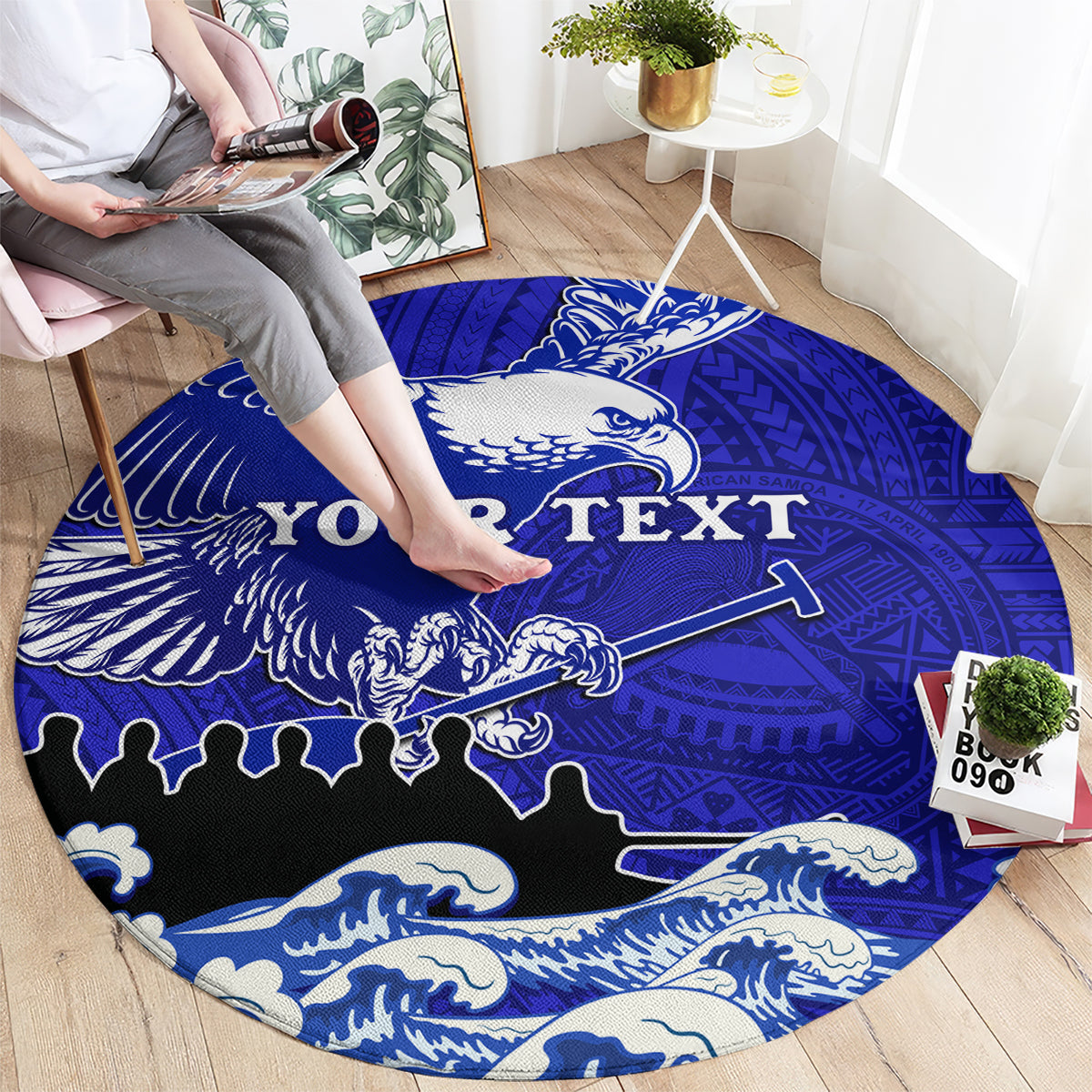 Round blue area rug with eagle motif and Polynesian pattern, custom text across center