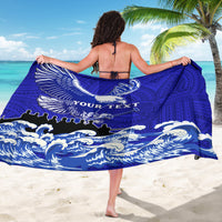 Blue sarong draped at back, white eagle and wave design with Polynesian motifs