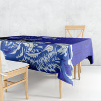 Blue Polynesian patterned race tablecloth with wave and emblem motifs draped on table