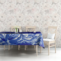 Blue eagle Polynesian pattern tablecloth laid on table with draped corner detail