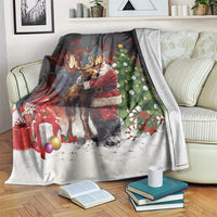 Christmas blanket featuring Santa hugging a moose, tree lights and gifts, black and white