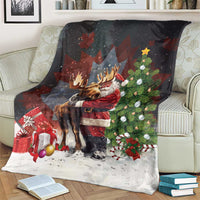 Christmas blanket draped on sofa, Santa hugging moose with tree and presents, black and white