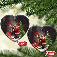 Black ceramic Christmas ornament shaped like a heart, Santa hugging a moose with holiday decor.