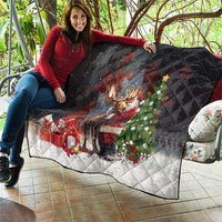 Black Christmas quilt draped on a sofa, diamond quilting with Santa hugging a moose