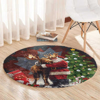 Black round Christmas rug on wood floor, featuring Santa hugging moose and pine trees