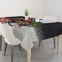 Christmas tablecloth corner detail with Santa and moose, snowy speckle pattern, and holly decor
