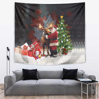 Black holiday tapestry with Santa hugging a moose, presents, and Christmas tree.