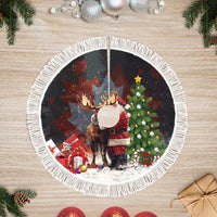 Black round tree skirt with Santa hugging a moose and white fringe trim
