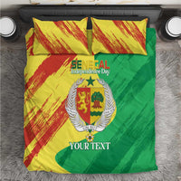 Bedding set with yellow, red, and green coat of arms graphic and matching pillows