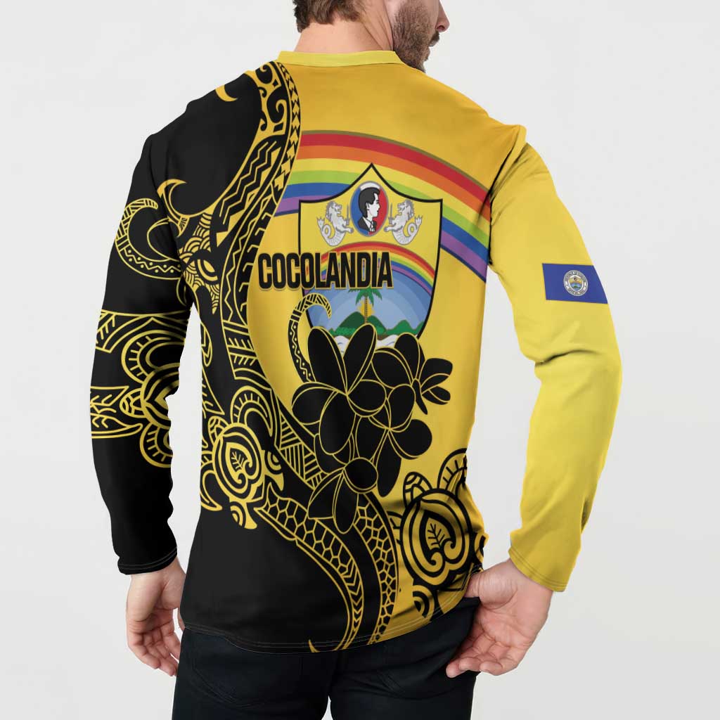 Back view of gold and black sweatshirt with COCOLANDIA crest and tropical flower graphic