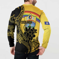 Back view of gold and black sweatshirt with COCOLANDIA crest and tropical flower graphic