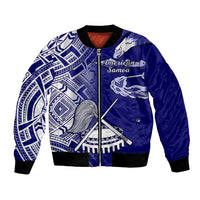 Blue bomber jacket with full-zip front, black ribbed cuffs, Polynesian pattern graphic