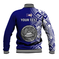 Blue baseball jacket back with circular seal graphic and 'YOUR TEXT' panel; striped ribbed hem