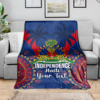 Blue dashiki-style blanket on a sofa with palm trees and Independence Haiti Your Text design
