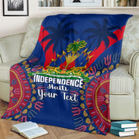 Blue blanket draped over couch with palm tree graphic and Independence Haiti Your Text