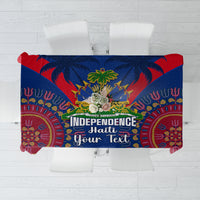 Blue tablecloth with Independence Haiti text and dashiki-style pattern, red and gold accents