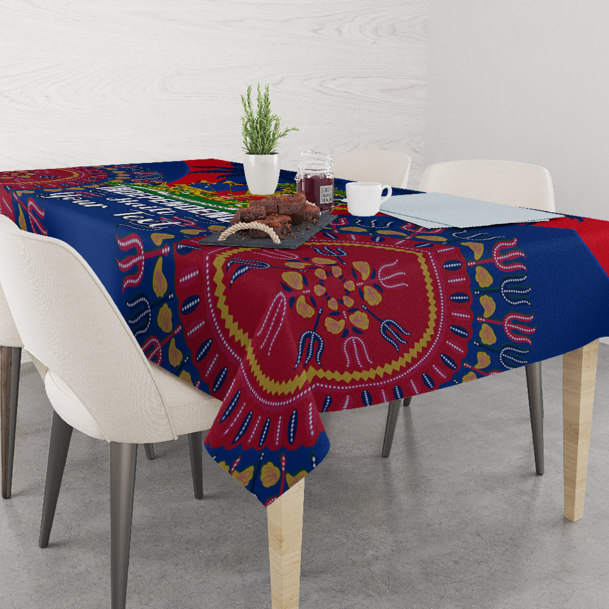 Blue tablecloth with circular dashiki motifs and red drape over dining table