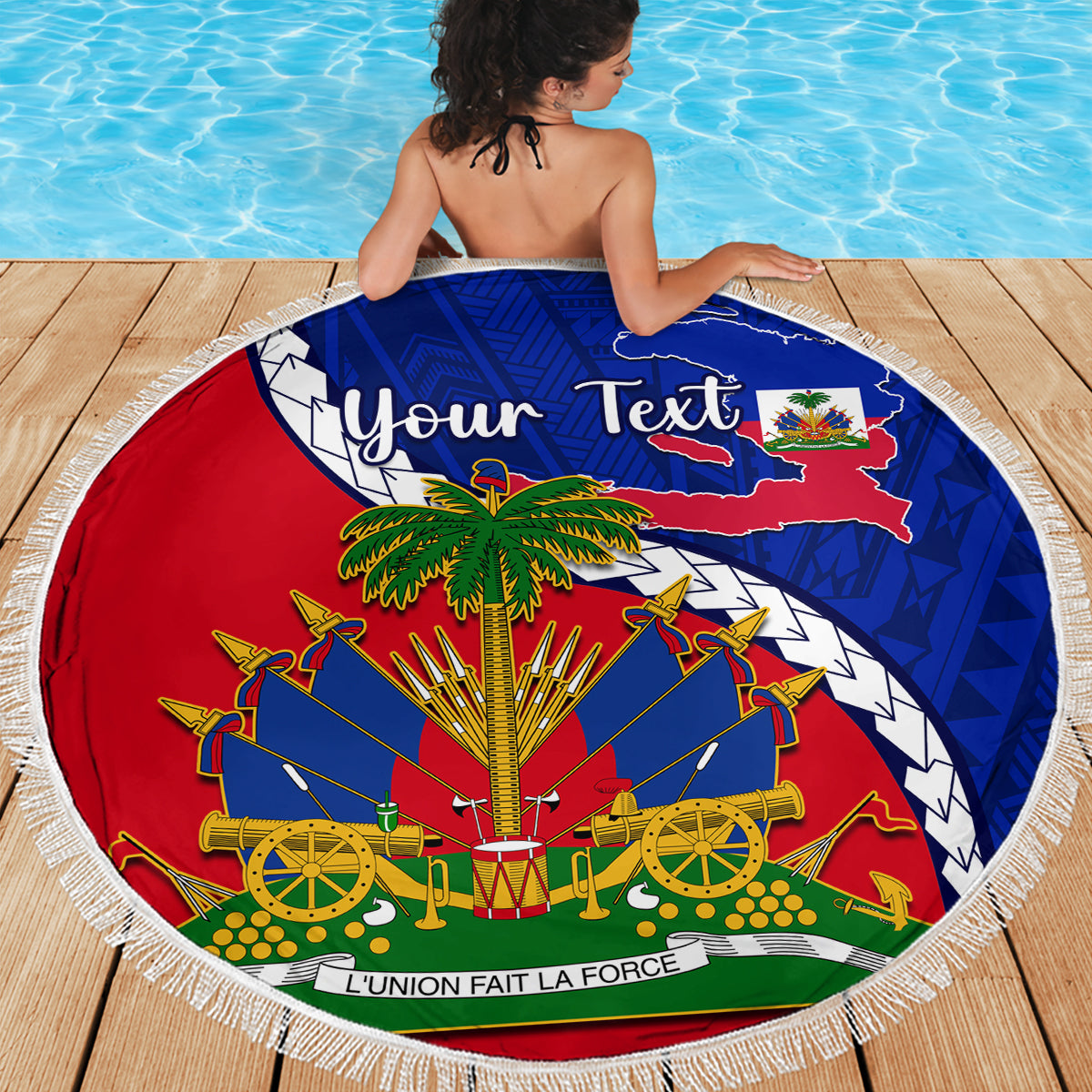 Round beach blanket with fringe, Haiti emblem and 'Your Text' on blue/red pattern by pool