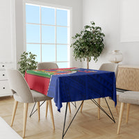 Blue and red rectangular tablecloth with Haiti emblem, polynesian-style geometric pattern.
