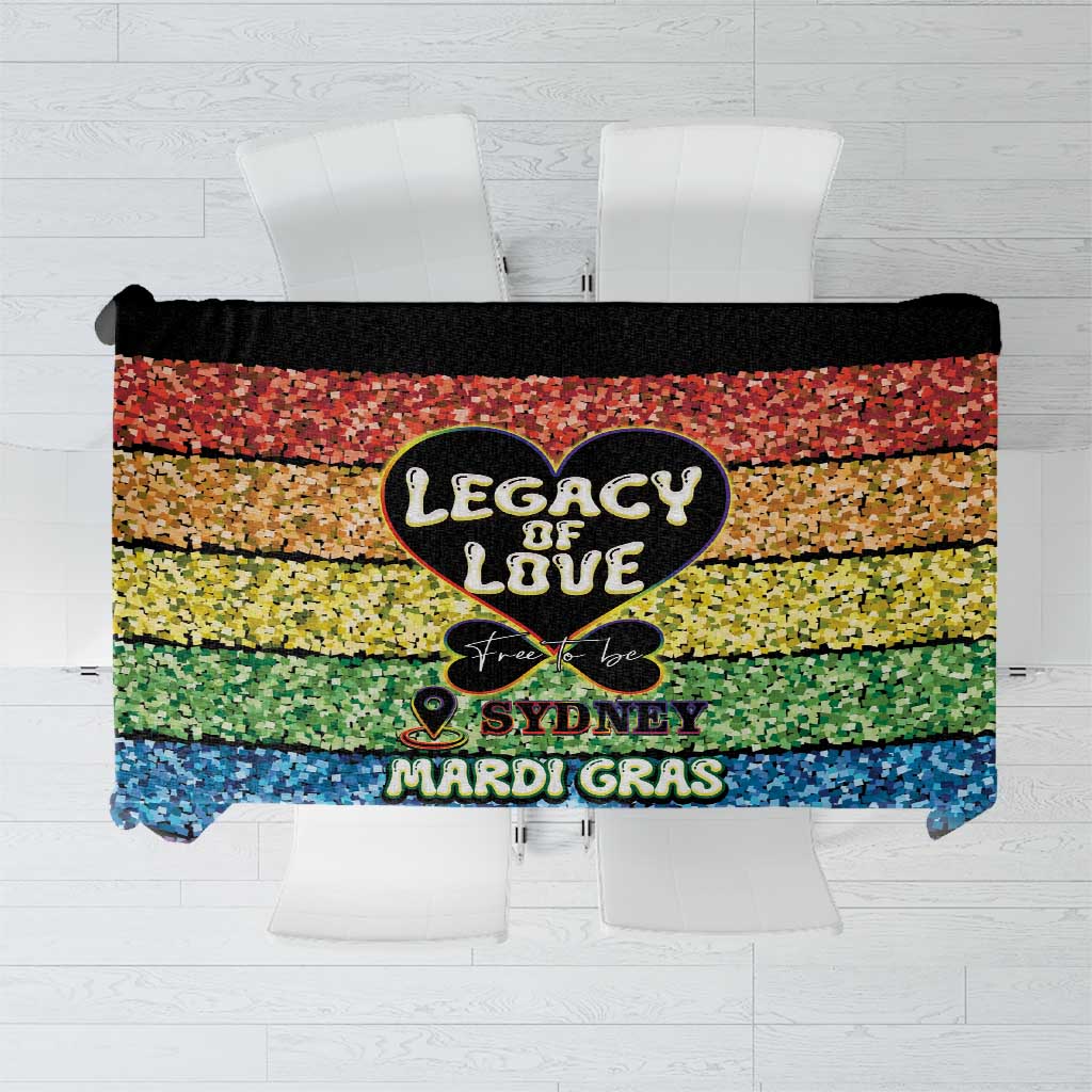 Rainbow pixel tablecloth with central “Legacy of Love” heart and “Sydney Mardi Gras” text.