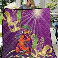 Purple quilt with jester lobster graphic, Mardi Gras beads and fleur-de-lis style prints