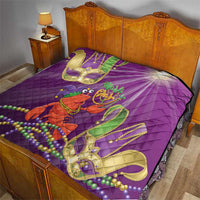 Purple quilt on bed with jester lobster print, Mardi Gras beads, and green and gold mask shapes