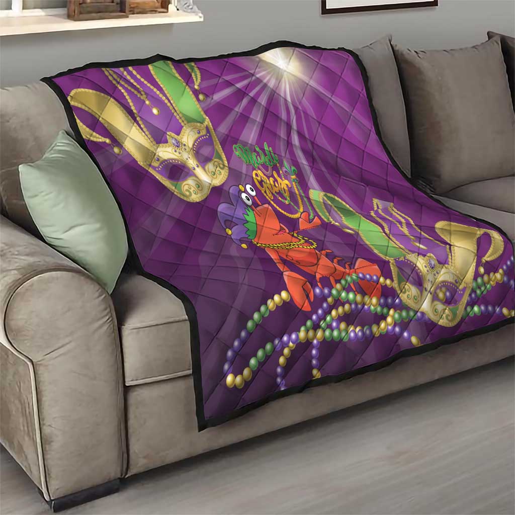Purple throw quilt on sofa with jester lobster design, green and gold mask shapes, bead strands