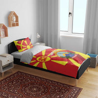Macedonia flag bedding set on a bed, red and yellow geometric sunburst with crest panel